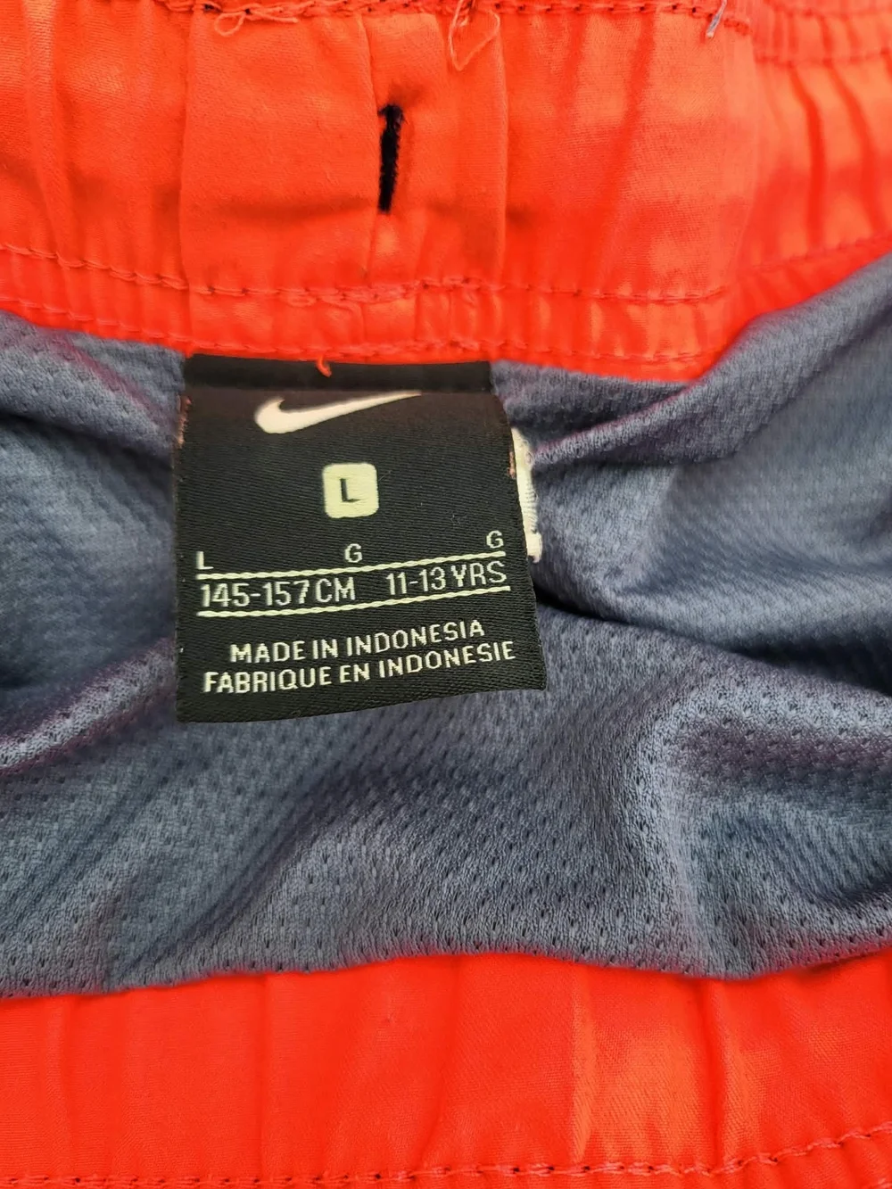 Nike Youth Navy Swim Trunks with Pink & Orange Accents